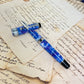 Pre-Owned Aurora Optima Caleidoscopio Luce Blu Fountain Pen 18K F